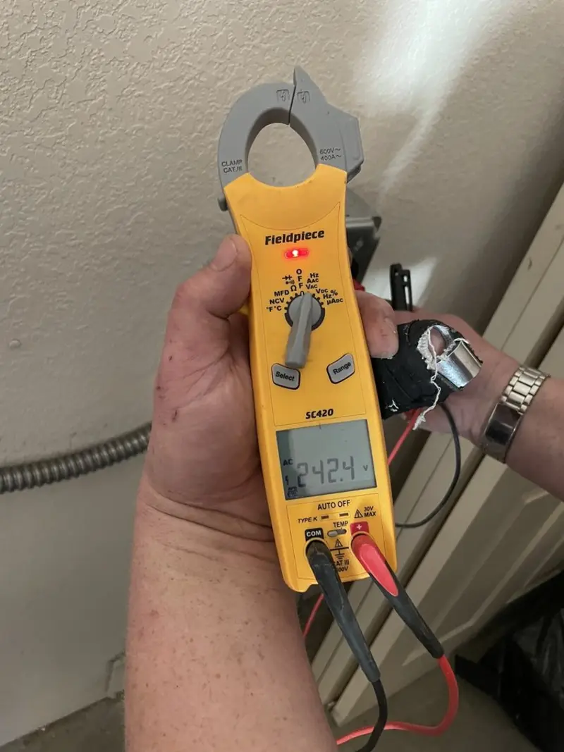 Voltage testing with clamp meter during Ceiling Fan Installation in Russellville